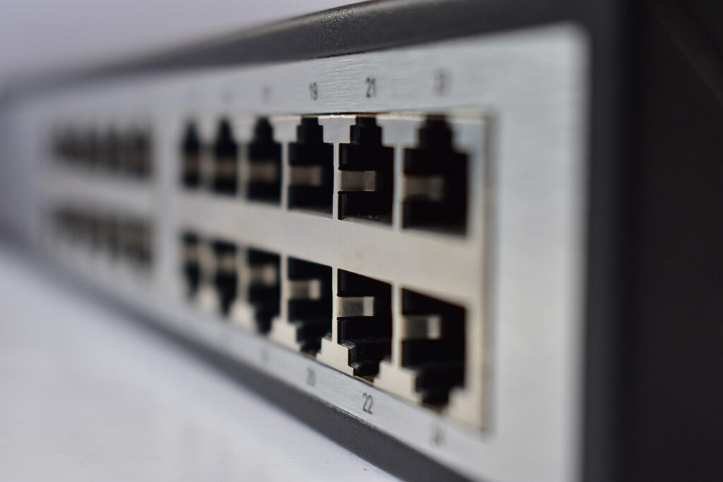 A row of ethernet ports on the back of a PoE+ device.