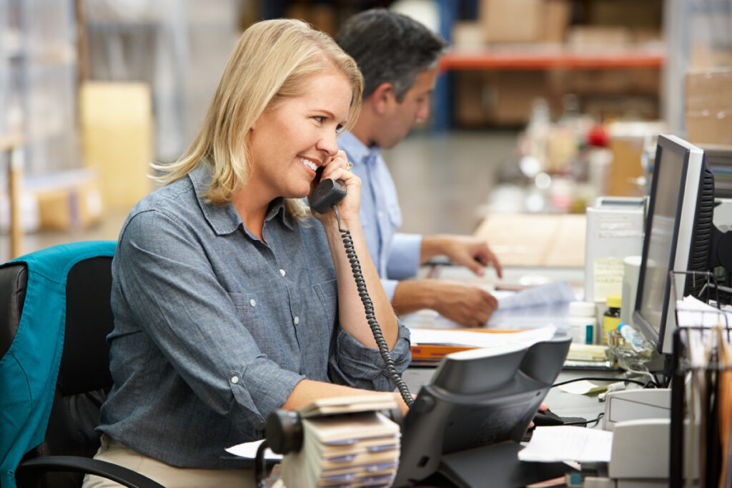 a woman on the phone in an office.